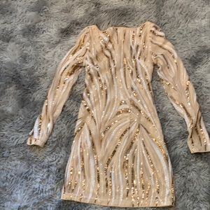 Never worn sequined dress with open back.